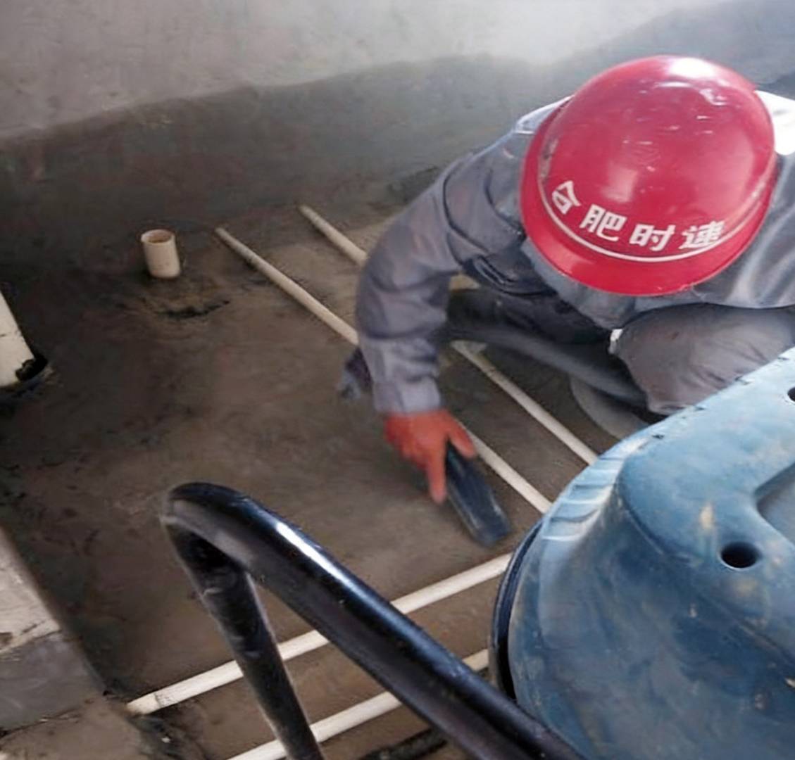 Wet area waterproofing at wall and floor interfaces